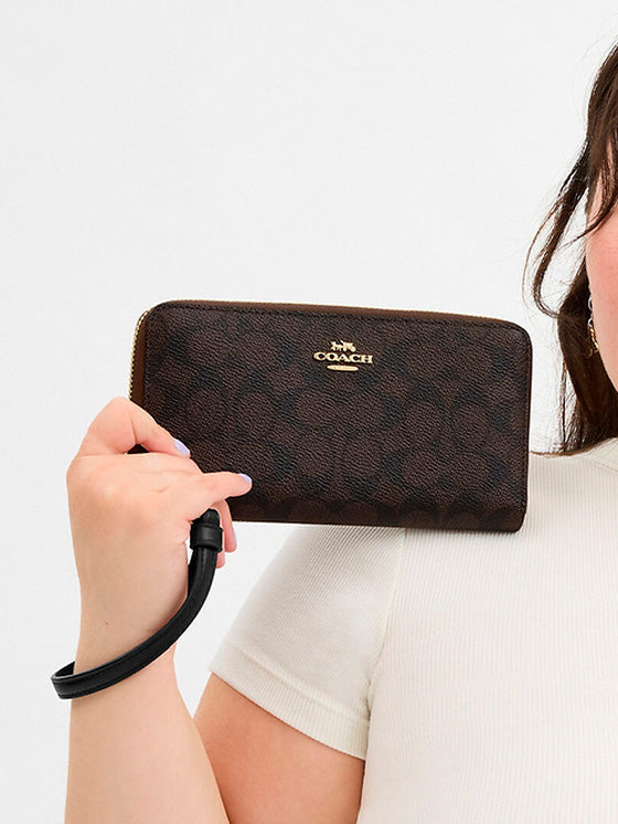 Cartera Coach con cierre largo en lona Marrón